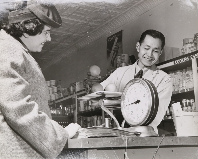 Jobu Yasumura working the counter at his family's New York City co-op, 1943.